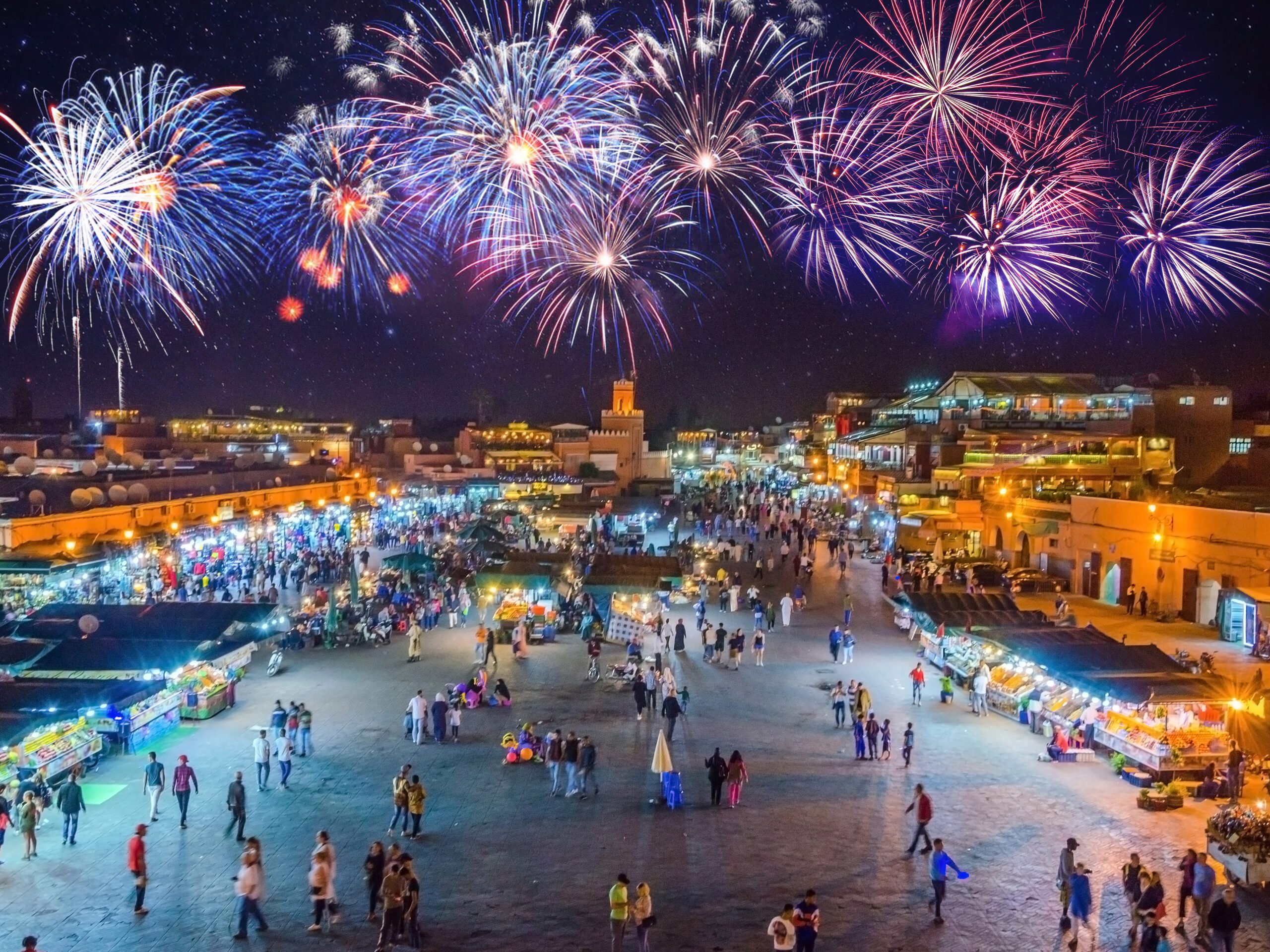 Jamaa el Fna market square in Marrakesh’s medina with fireworks, Marrakesh, Morocco cheapest places to celebrate new year around the world - Marrakech, Morocco