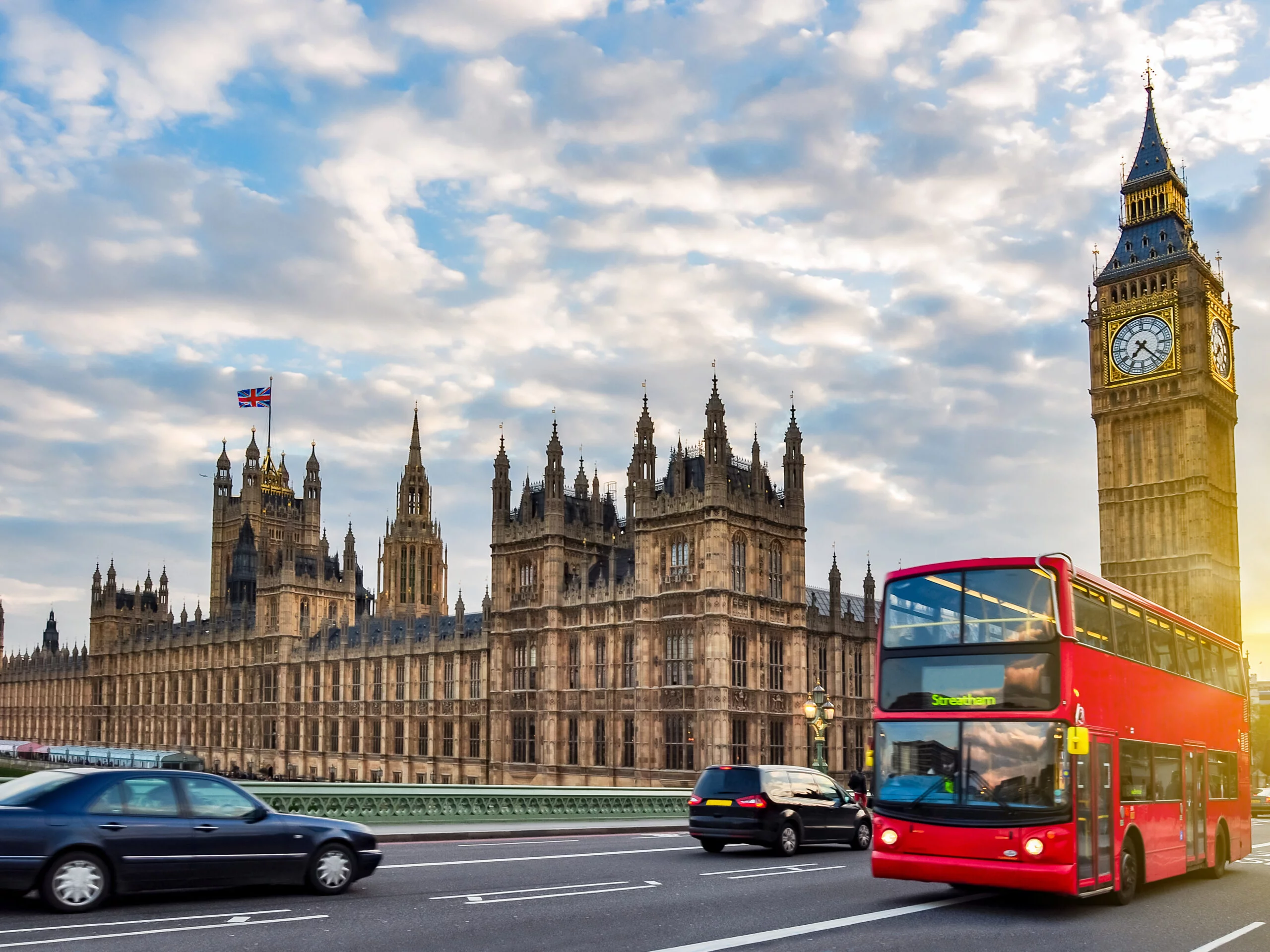 Houses of Parliament with Big Ben and double-decker bus on Westminster bridge at sunset, London, UK Top 5 destinations in UK - London