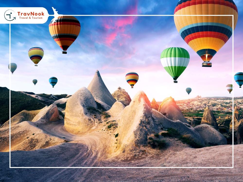 Best places to visit in Turkey during winter - Cappadocia, Experience Cappadocia hot air balloons over rocky landscape